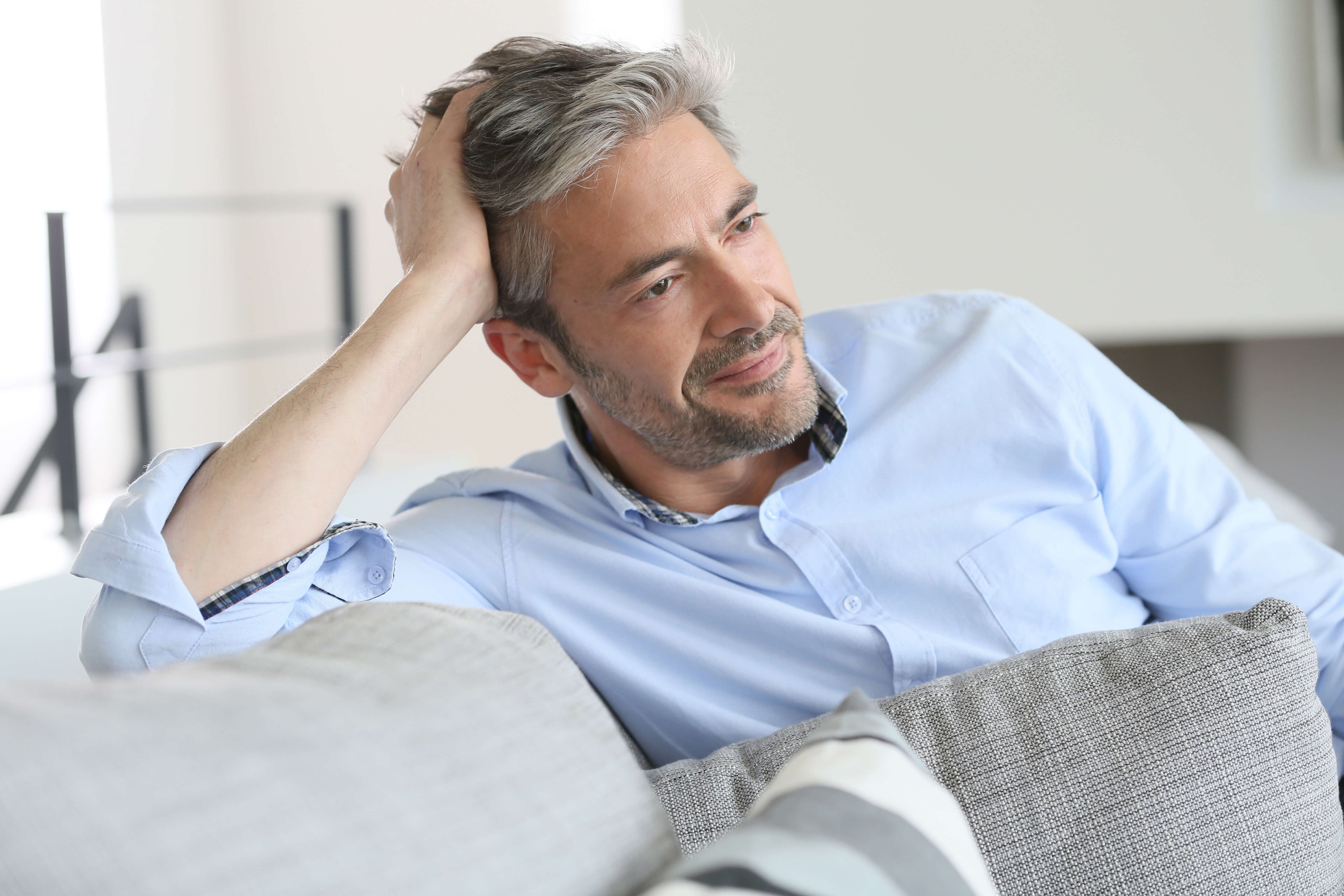 smiling-handsome-45-year-old-man-relaxing-at-home-ron-barak